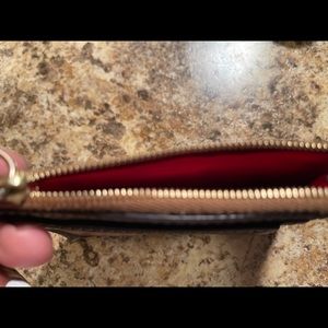 Donney & Burke wrist wallet.